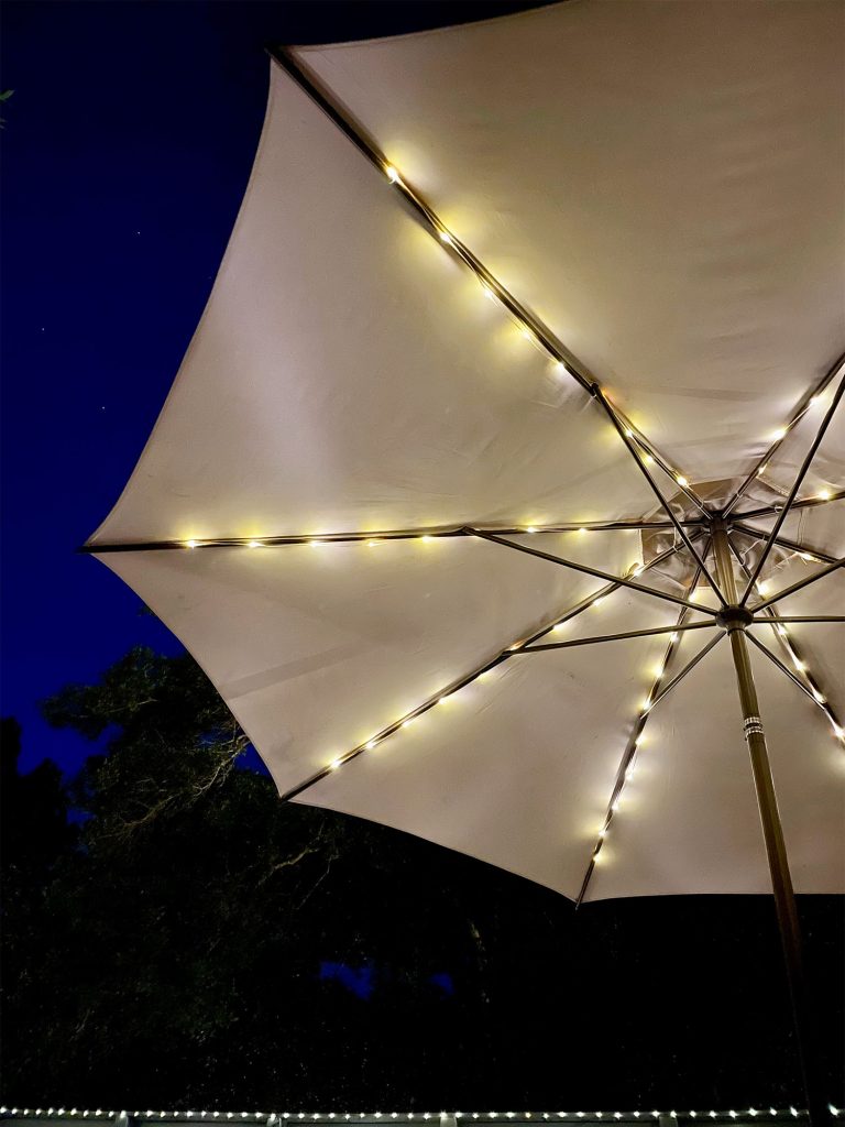 Underside Of Patio Umbrella With Solar LED Lights At Night