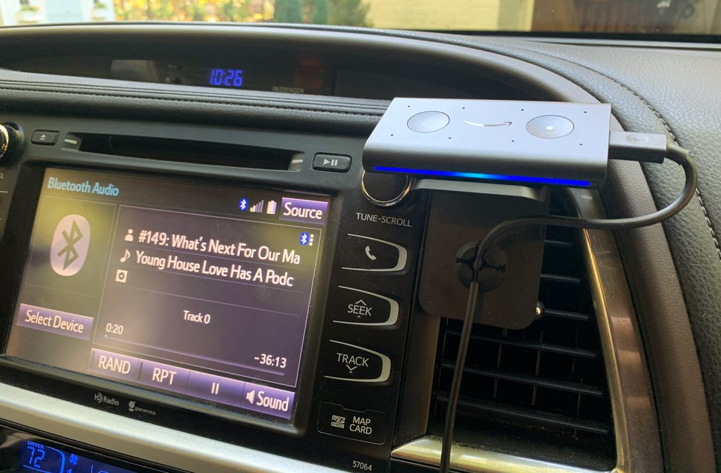 Amazon Echo Auto Smart Device Mounted To Car Dashboard