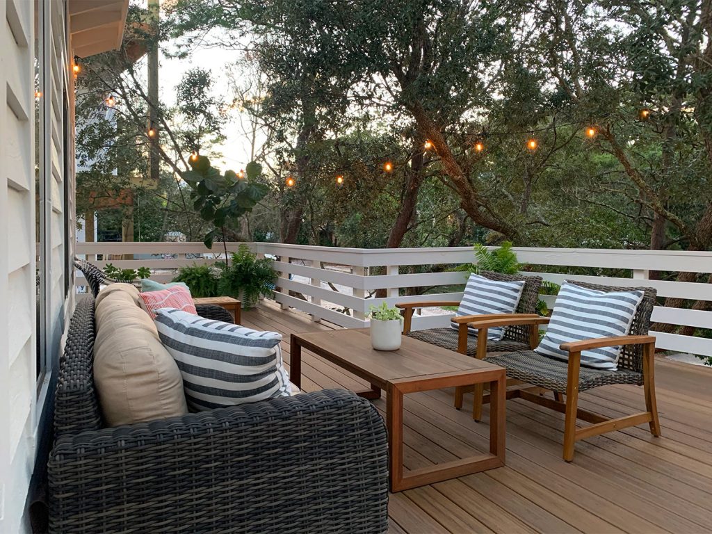 Dusk View Of Outdoor Deck Surrounded By Trees