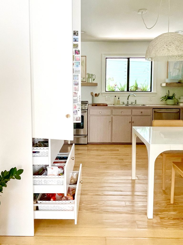 Ikea Built-In Pantry With Lower Drawers Open to Show Walking Space