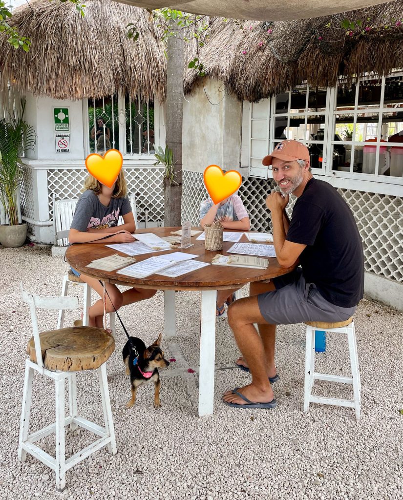 Dining Outdoors in Tulum Mexico With Dog Under Table
