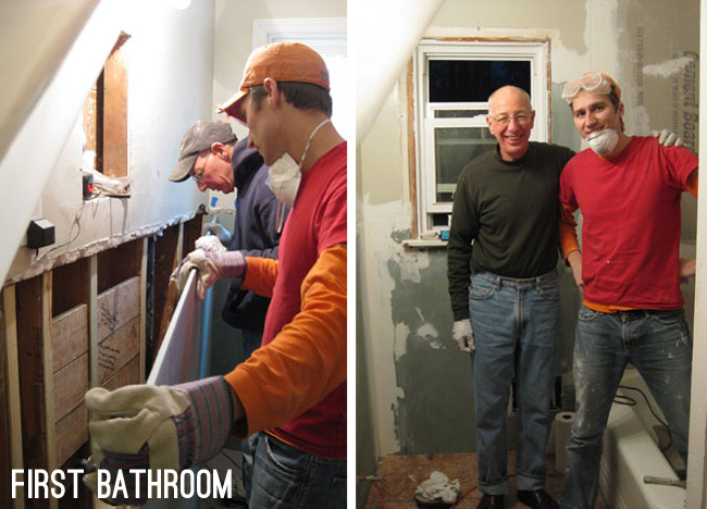 father and son installing drywall in old house's bathroom