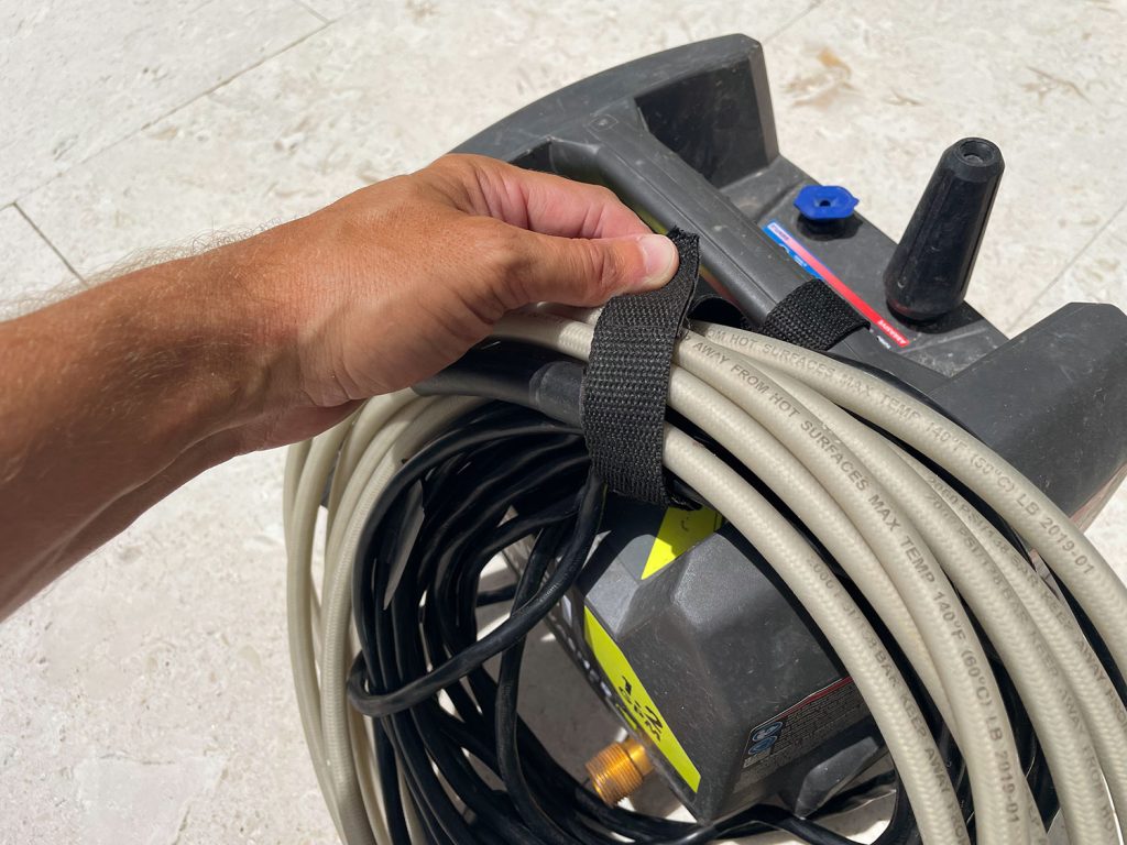 Securing cords on Ryobi electric pressure washer with built in velcro strap