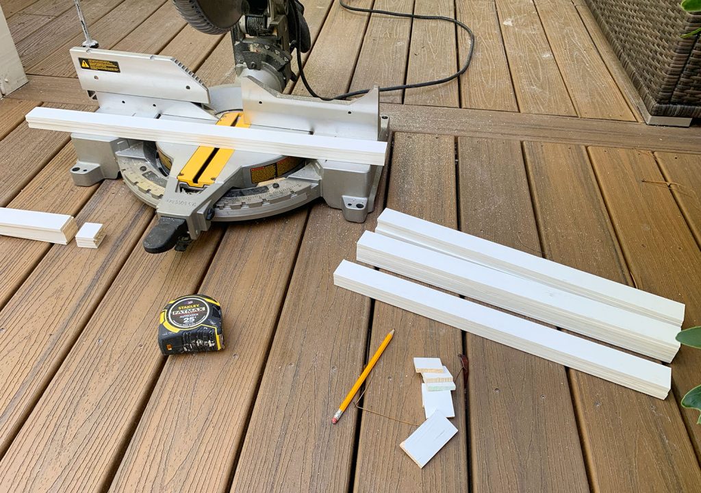 Miter Saw On Deck With Cut Pieces Of White Lattice
