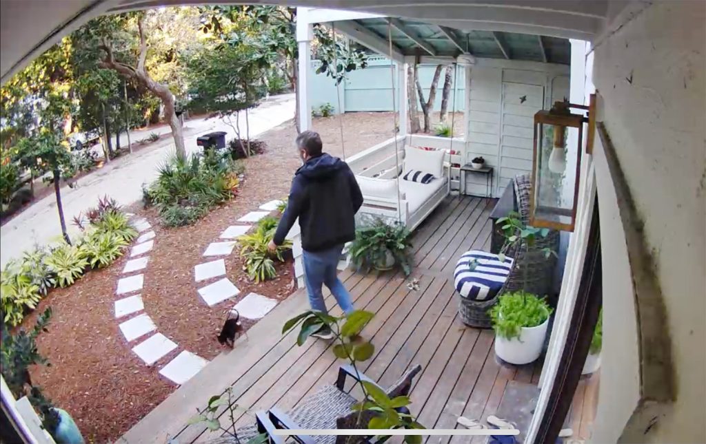 Security Camera Footage of Front Porch With John Walking Penny